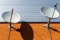 Two satellite dishes on the brick wall Royalty Free Stock Photo