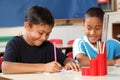 Two school boys enjoying their learning in class