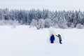 Two school kid boy walking in snowy winter forest. Happy children having fun outdoors in winter. Family, siblings and Royalty Free Stock Photo