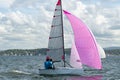 Two school kids sailing small sailboat with a fully deployed vib