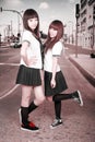 Two schoolgirls outdoors. Royalty Free Stock Photo