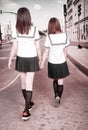 Two schoolgirls outdoors. Royalty Free Stock Photo