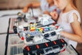 Two schoolgirls study in a robotics class, assemble a robot constructor Royalty Free Stock Photo