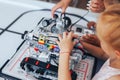 Two schoolgirls study in a robotics class, assemble a robot constructor Royalty Free Stock Photo