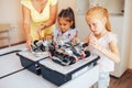 Two schoolgirls study in a robotics class, assemble a robot constructor Royalty Free Stock Photo