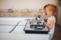 Two schoolgirls study in a robotics class, assemble a robot constructor Royalty Free Stock Photo