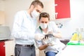 Two scientist looking at tablet and working on pharmaceutical experiments Royalty Free Stock Photo