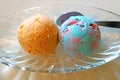 Two Scoops of Orange Ice Cream and Bubble Gum Ice cream Served in a Glass Bowl Royalty Free Stock Photo