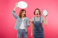 Two screaming women friends holding speech bubbles.