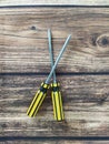 Two screwdrivers on a wooden table Royalty Free Stock Photo