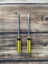 Two screwdrivers on a wooden table Royalty Free Stock Photo