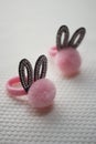 Two scrunchy for hair with black ears in rhinestones and a soft pink pompom Royalty Free Stock Photo