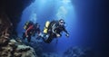 Two Scuba Divers Venturing into the Mysterious Depths of an Underwater Cave Royalty Free Stock Photo