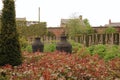 Two sculpted Stone pots in walled garden