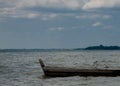 Two seagulls at a lake - on the water, sitting in a boat, and standing on the boat Royalty Free Stock Photo