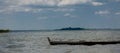 Two seagulls at a lake - on the water, sitting in a boat, and standing on the boat Royalty Free Stock Photo