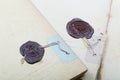 Two sealing wax press on writing-books Royalty Free Stock Photo