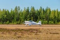 Two-seat single-engined piston-powered homebuilt airplane Vans RV-6E OH-XTH landing on Karhula aviation museum airshow. Kotka,