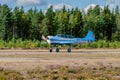 Two-seat single-engined piston-powered Yakovlev Yak-52 primary aerobatic trainer aircraft OH-YAC landing on Karhula aviation Royalty Free Stock Photo