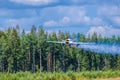 Two-seat single-engined piston-powered Yakovlev Yak-52 primary aerobatic trainer aircraft OH-YAC performs aerobatics at Karhula