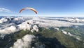 Two-seater paraglider above the clouds Royalty Free Stock Photo