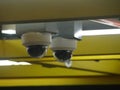 Two security cameras dome type install on the ceiling Royalty Free Stock Photo