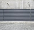 Two security cameras hanging on the concrete wall of the building, aimed at the space behind the fence Royalty Free Stock Photo