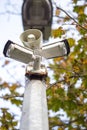 Two security cameras and loudspeaker on a metal post. Safety industry concept. Modern surveillance concept Royalty Free Stock Photo