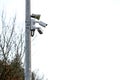 Two security cameras and loudspeaker on a metal post. Safety industry concept. Modern surveillance concept
