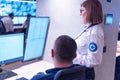 Two security guards working on computers while sitting in the main control room, CCTV surveillance Royalty Free Stock Photo