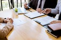 Two selection committee manager reading a resume during a job interview, Employer interviewing to ask young female job seeker for