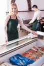 Two sellers of frozen fish Royalty Free Stock Photo