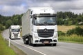 Two Semi Trailer Trucks Transport Goods on Road Royalty Free Stock Photo
