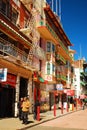 Two senior adults stroll through San FranciscoÃ¢â¬â¢s Chinatown