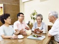 Two senior asian couple chatting Royalty Free Stock Photo