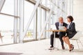 Two senior business colleagues at meeting in modern interior Royalty Free Stock Photo