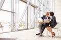 Two senior business colleagues at meeting in modern interior Royalty Free Stock Photo