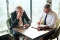 Two Senior businessman couple meeting in co working space or office Royalty Free Stock Photo