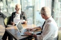 Two Senior businessman couple meeting in co working space or office Royalty Free Stock Photo