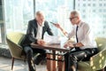 Two Senior businessman couple meeting in co working space or office Royalty Free Stock Photo