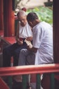 Two senior chinese men playing cards Royalty Free Stock Photo