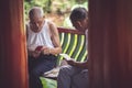 Two senior chinese men playing cards Royalty Free Stock Photo