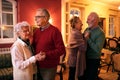 Two senior couple dancing romatic at nursing home Royalty Free Stock Photo