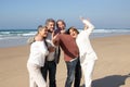 Two senior couples having fun at the beach Royalty Free Stock Photo