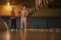 Two Senior Friends Playing Bowling Side View Royalty Free Stock Photo