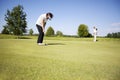 Two senior golf player on green. Royalty Free Stock Photo