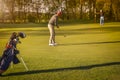 Two senior golfer playing golf at dusk. Royalty Free Stock Photo