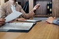 Two senior manager reading a resume during a job interview, Employer interviewing to ask young male job seeker for recruitment ta Royalty Free Stock Photo