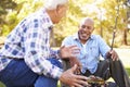 Two Senior Men On Camping Holiday With Fishing Rod Royalty Free Stock Photo