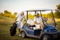 Two senior men golfers on court. Royalty Free Stock Photo